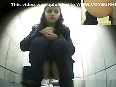 Cute chick peeing in public toilet