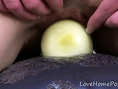 Blonde with small tits enjoys the onion