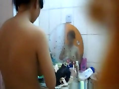 Asian woman showering and drying