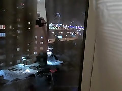 Young couple fuck at window.