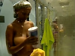 Big tits ebony woman showering