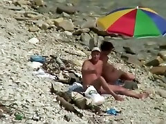 Nudist man fucking nude woman in beach