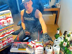 Cumshot smoking in front of marlboro reds pack in leather
