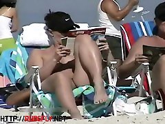 Couple split by Strangers on a butt giggle beach