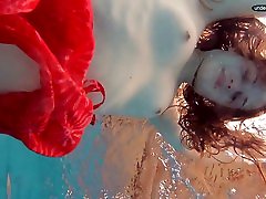 Red Dressed armi gril swimming with her eyes opened
