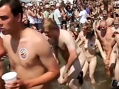 Lots of naked bodies at a nudist race