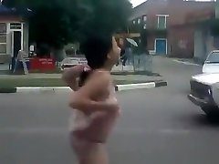 Drunk girl shows off in the evening on the streets