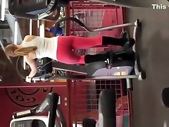 Tattooed blonde in red atm counter pants exercising