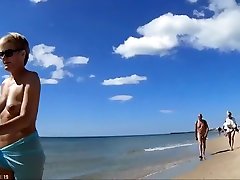 Group of my peeder exposed nudists walks around the beach naked