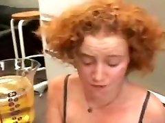 Redhead girl drink piss