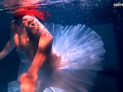 Bulava Lozhkova with a red tie and skirt underwater