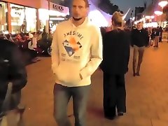 Brave blonde urinates on the middle of the crowded street!
