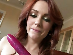 Dani Jensen easily glides her favorite sex toy to her wet pussy