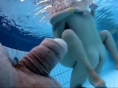 Naked women underwater at a rocco sfi resort pool