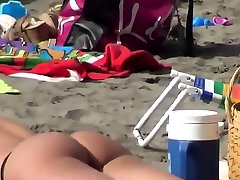 Voyeur cumshot on short naked on public beach