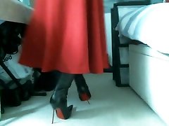 Red midi skirt and pointed italian thigh high boots