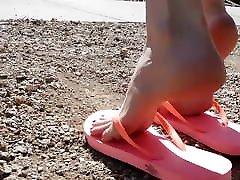 Emily modeling sexy pink flip flops and pale skin