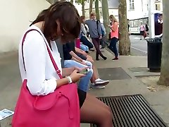 Candid black pantyhose woman waiting at bus station
