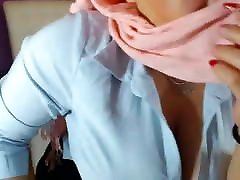 Muslim in hijab fondles her huge boobs
