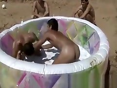 Naked boys wrestling on the beach 3
