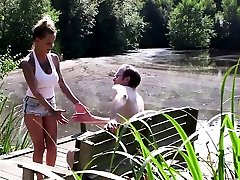 Busty femdom tugging guy outdoors for spunk