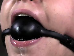 Drooling submissive blindfolded during BDSM