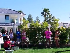 Swinger wives play around with the guys by the poolside