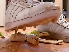Crushing Juicy Bananas In Well Worn White Adidas Trainers