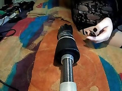 Fi fi in black with fucking machine hand dildo front