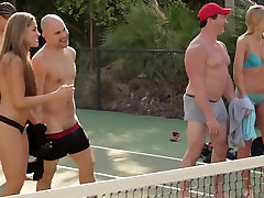 Trish and Jp play tennis with others