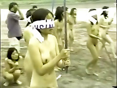 japanese xana linda girls splitting a watermelon with a stick while blindfolded