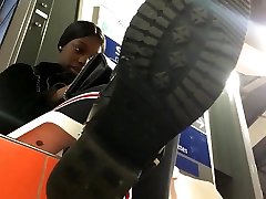 Under a cute ebony chicks boot