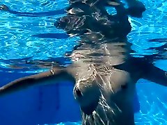 Hot sexy body in a cool Ibiza pool with a guy, relax music
