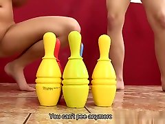 Lesbians knock down bowling pins with their piss
