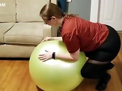 Collared slave fucks a dildo on her yoga ball with DP anal plug