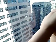 Exhibitionist Twink Fucks his Hole on High Rise Hotel Window Part 1