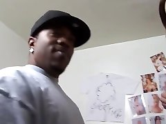 Busty slut deep throats black cock in the bedroom