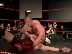 wrestler pulls his trunks down in the ring.