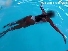 See-through White news castrr In Public Pool