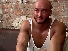 Gay hunk with superb physique masturbating passionately