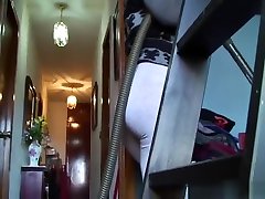 Big pregnante sexy momma vacuuming the house