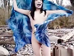 Asian slut is on the beach have sex in flight posing