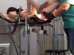 girl in a black mask. exam in gyno chair