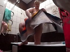 Lesbian has installed a white skin baby camera in the bathroom at his girlfriend. Peeping behind a bbw with a big ass in the shower. Voyeur.