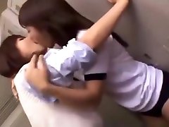 Two Schoolgirls Kissing in Locker Room