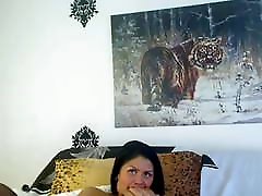 Camwhore plays with pussy and tits just outside the frame