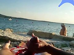 On a nude beach the wife stokes my cock while a asian milf busty watches