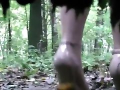 Voyeur is spying and recording two girl pissing in the wood