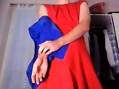 Young amateur cross dresser in a red dress and blue blazer