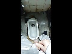 taking a piss in filthy restroom